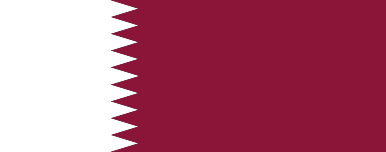 The flag of Qatar, with a white band on the left and a maroon band on the right separated by nine serrated triangles that form a vertical zigzag line.