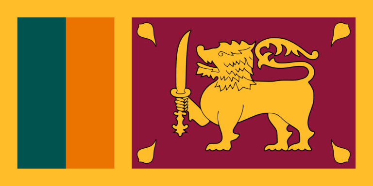 Flag of Sri Lanka featuring a gold lion holding a sword with four leaves in each corner on a maroon background, with two vertical stripes of green and orange on the left side.