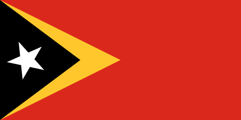 The flag of Timor-Leste with a black triangle superimposed on a yellow triangle, on a red field, with a white star in the center of the black triangle.